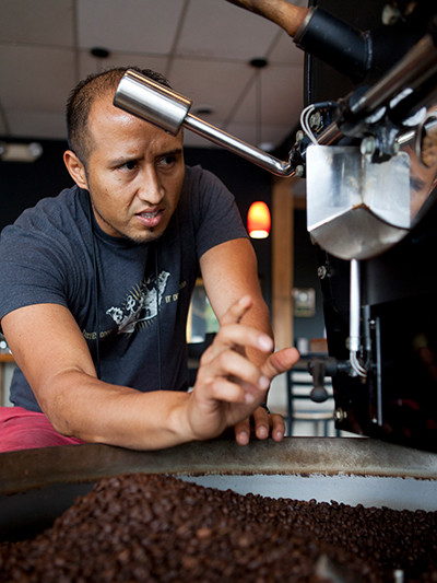Geovanni Leiva, co-founder of Leiva's Coffee, roasts a batch of coffee beans.