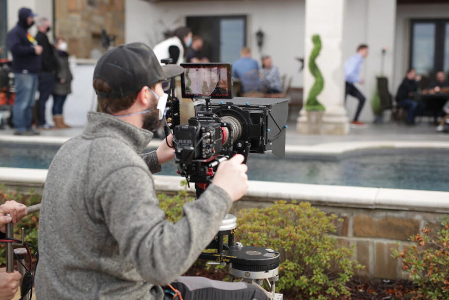 Stone Ward Director of Photography Dustin Jones filming a wide shot in the Sissy’s Log Cabin commercial the Little Rock marketing agency made for the Super Bowl.
