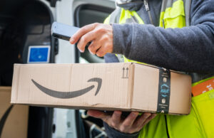 An Amazon Prime delivery agent scans barcodes on boxes