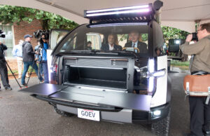 Canoo Inc. CEO Tony Aquila, left, shows Arkansas Gov. Asa Hutchinson the inside of one of the company's electric vehicles during an event at the Governor's Mansion on Feb. 22, 2022.&nbsp;