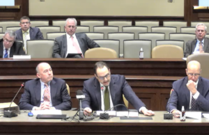 Carlton Saffa, chief market officer for Saracen Casino, center, is flanked by attorneys for Southland and Oaklawn casinos as he speaks to a state legislative committee reviewing rules for mobile sports betting.&nbsp;