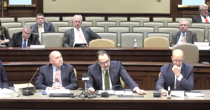 Carlton Saffa, chief market officer for Saracen Casino, center, is flanked by attorneys for Southland and Oaklawn casinos as he speaks to a state legislative committee reviewing rules for mobile sports betting.&nbsp;