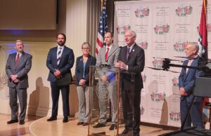 Arkansas Gov. Asa Hutchinson with members of the Arkansas Council on Future Mobility (from left) Alan Mantooth, council chairman Cyrus Sigari, council members state Secretary of Transportation Lorie Tudor, state Secretary of Commerce Mike Preston and Canoo Inc. CEO Tony Aquila.