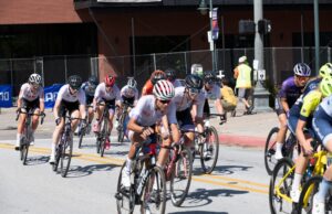Cyclists travel down the streets of Fayetteville in the 2021 Joe Martin Stage Race