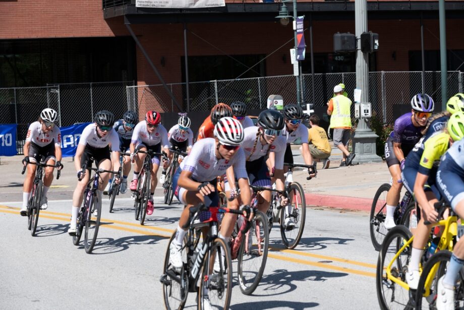 Cyclists travel down the streets of Fayetteville in the 2021 Joe Martin Stage Race