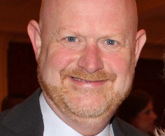 A photo of Jay Barth at an event photographed by Arkansas Business in 2017.