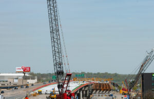 30 Crossing is in full swing on the Little Rock side of the river. Much of the ground equipment for the $1.1 billion effort came from Riggs Caterpillar.