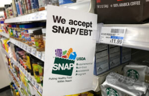 A sign showing that a grocery store participates in the SNAP program