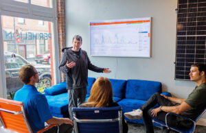 CEO Andrew Barrett of Perihelion Solar makes a point at the company&rsquo;s offices in downtown Russellville.