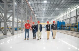 Atlas Tube workers tour the company's new electric resistance steel mill in Blytheville.