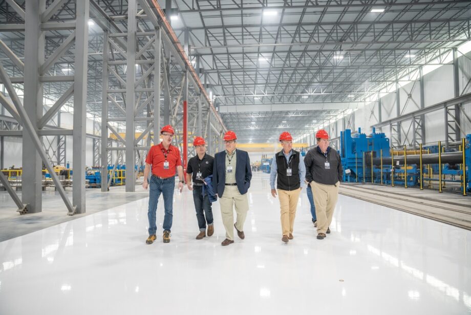 Atlas Tube workers tour the company's new electric resistance steel mill in Blytheville.