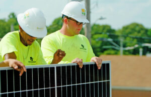 A crew from Seal Solar of North Little Rock installs solar panels at 107 Liquor in Sherwood.