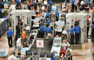 Travelers in long lines at Denver International Airport in July 2019.