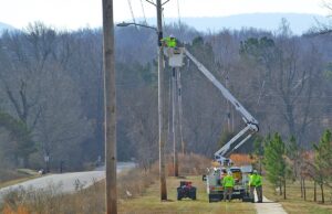 A crew strings high-speed cable.