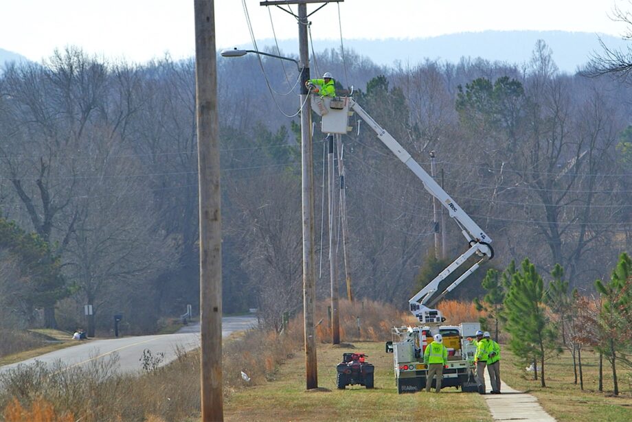 A crew strings high-speed cable.
