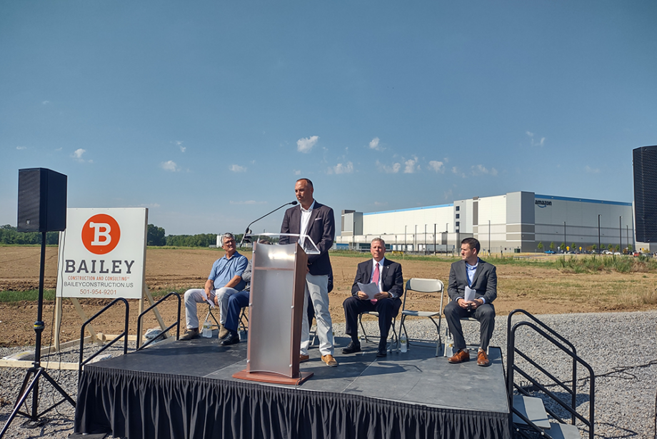 Luke Neville, co-founder and partner at Bluestem Partners of Kansas City, speaks at a groundbreaking ceremony for a warehouse project at the Little Rock Port on July 14, 2022.