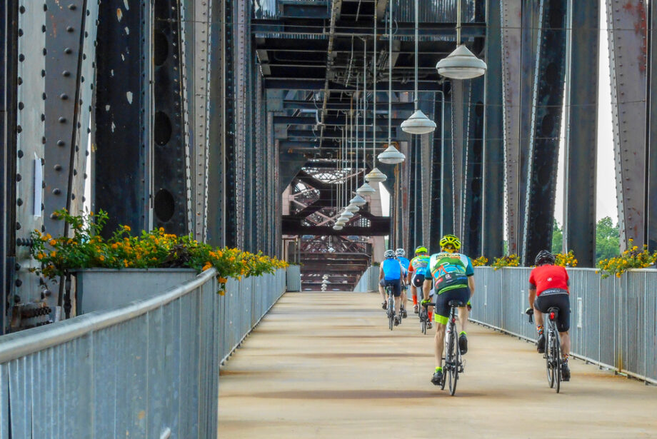 Cyclists cross the Clinton Presidential Park Bridge connecting Little Rock and North Little Rock over the Arkansas River. Housing construction in the Little Rock metro area hit a 14-year high in 2021.
