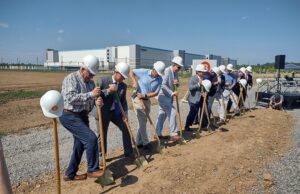 Amazon’s massive distribution center at the Port of Little Rock loomed in the background last month as Bluestem broke ground on its speculative warehouse project, nearly a million SF of space.