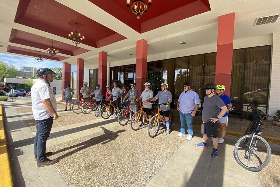 LaneShift CEO Ryan Hale addressed Metroplan members before they left on a bicycle tour of the Razorback Greenway from the Graduate Hotel in Fayetteville.