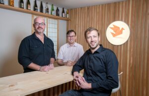 Matt Bell, Ben Bell and Cassady Harris in the tasting room at Origami Sake, now being assembled in Hot Springs. It will be Arkansas’ first sake brewery and one of only about 20 in the United States. Matt Bell and Ben Bell are co-owners of the sake brewery, and Harris is operations manager.
