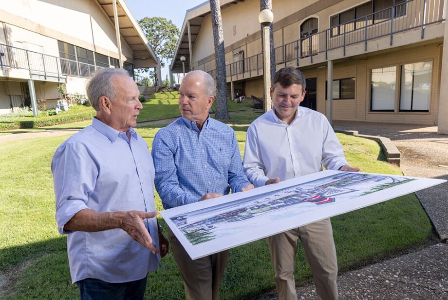 Restaurateurs Jim Keet, left, and his son, Jake, right, look over a rendering of the planned facade update for their future Waldo’s Chicken & Beer location with fellow Breckenridge Village Shopping Center investor Hank Kelley.