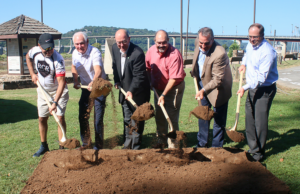 From left: Charles Mobley of the Major Taylor Cycling Club;&nbsp;North Little Rock Mayor&nbsp;Hartwick; Pulaski County Judge Bert Parker with Big Dam Bridge Foundation; and&nbsp;North Little Rock Parks Director Steve Shields break ground on the Big Dam Bridge North Plaza project.
