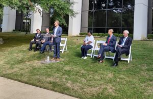 Arkana Laboratories of Little Rock CEO Dr. Chris Larsen, standing at the podium, announces the company's expansion on Sept. 7, 2022