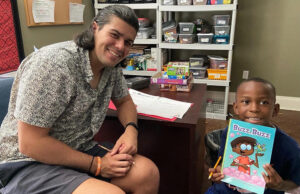 Tutoring time is a weekly highlight for AR Kids Read students. Smiles come naturally to John and Elijah in their weekly time together.