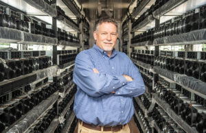 Jon Chadwell, executive director of the Newport Economic Development Commission, stands inside the new GMI Computing bitcoin mining hub.