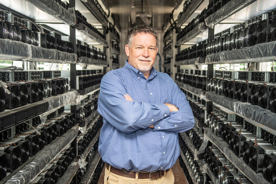 Jon Chadwell, executive director of the Newport Economic Development Commission, stands inside the new GMI Computing bitcoin mining hub.