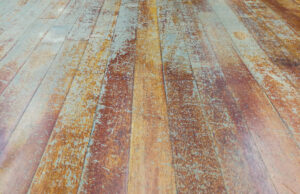 A file photo of corroded and damaged wooden floor planks