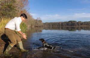 Arkansas Game & Fish Commission Director Austin Booth and his&nbsp;16-week-old black lab, Coupe.