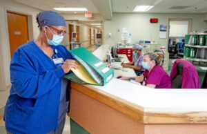 Tracie Ford, a registered nurse on the medical surgical floor, reviews a patients chart.