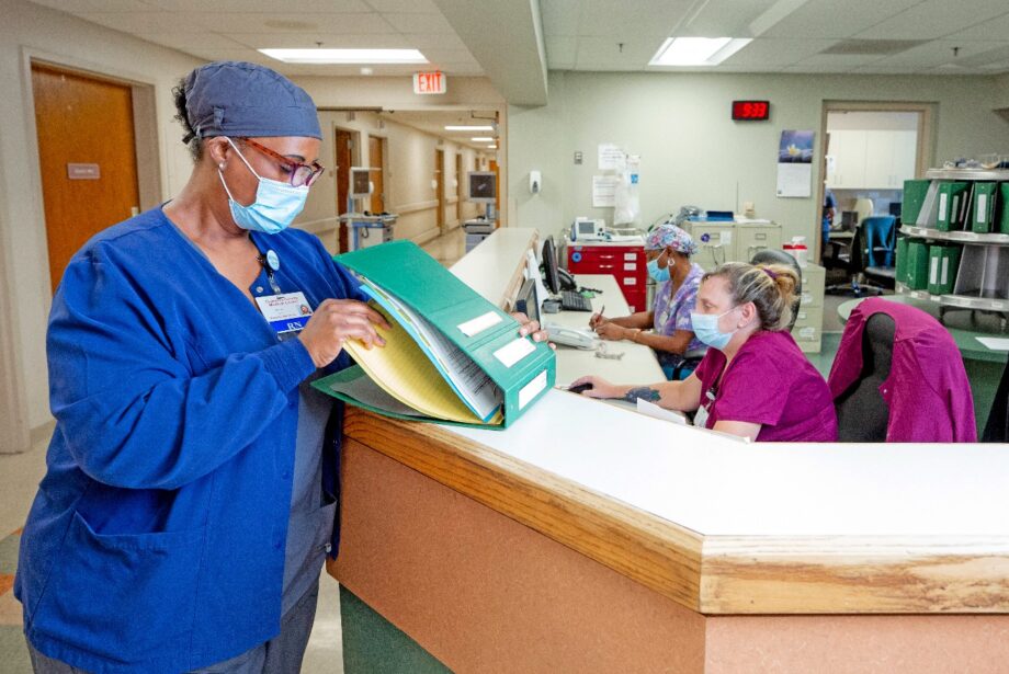 Tracie Ford, a registered nurse on the medical surgical floor, reviews a patients chart.