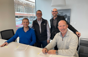Glenn Crockett, Drew Spurgers, Jakob Michealis and Jeff Standridge at the recent contract signing for the Dave Creek Media/Kanga Studio merger