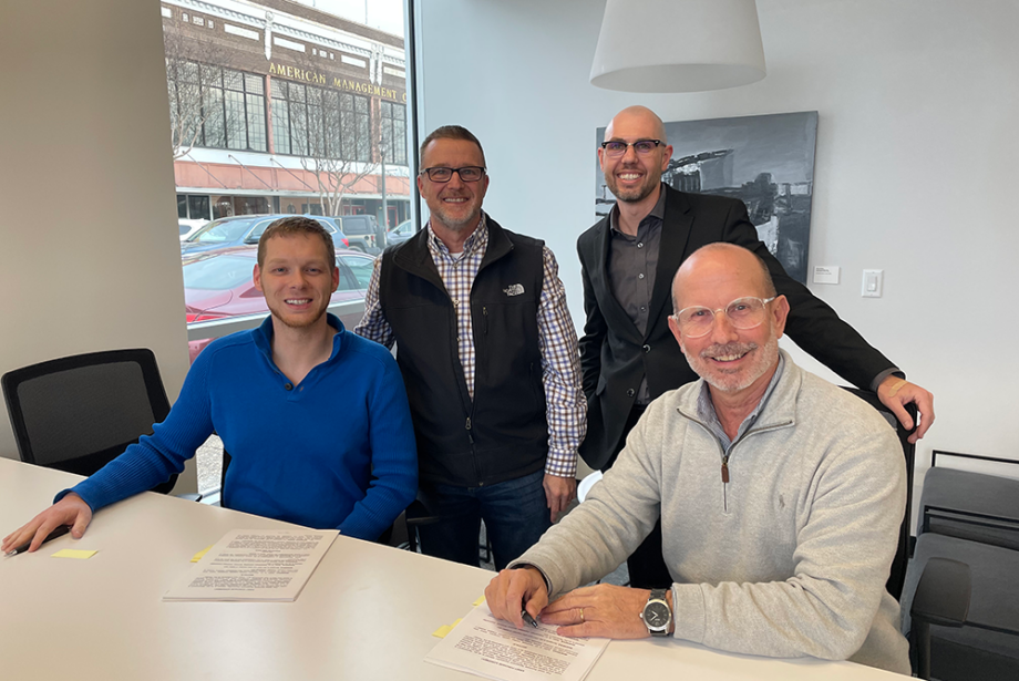 Glenn Crockett, Drew Spurgers, Jakob Michealis and Jeff Standridge at the recent contract signing for the Dave Creek Media/Kanga Studio merger