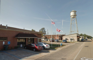 A Google Street View image of Earle City Hall and the city water tower