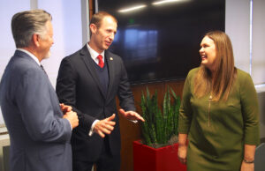 Gov.-elect Sarah Huckabee Sanders talks to Commerce Secretary Mike Preston (center) and Hugh McDonald, the former Entergy Arkansas Inc. CEO who she will nominate to lead the Commerce Department.