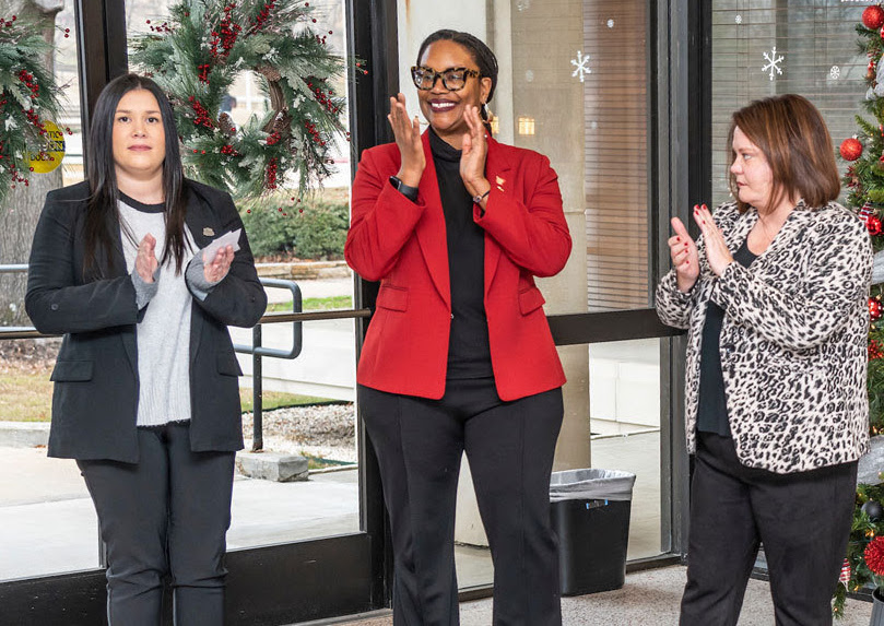 From left: Jessica Brogdon, a senior business administration major, Graduate School Dean Cherisse Jones-Branch, and Andrea Allen, executive director of the Delta Center for Economic Devlopment, cheer the announcement of Gov. Hutchinson's support and an anonymous donor's gift for the Arkansas Delta Women's Leadership Academy at A-State.