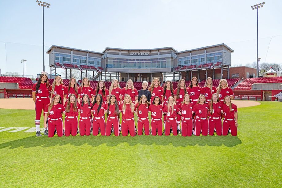 Susie Everett of Everett Automotive Group, surrounded by the UA softball team, with which the group has an NIL deal.