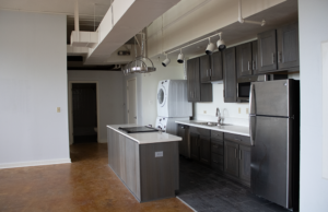 A unit at the Lofts at SoMa, a former high school built in 1904. The building was purchased in 2013 by Jill Judy and Mark Brown of Downtown Dwellings, developers focused on rehabbing historic properties.