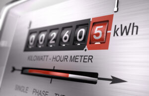 A close up shot of an electric meter, used to measure electricity usage on a building.