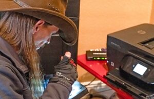 A high-speed broadband technician in northwest Arkansas connects one of OzarksGo’s 35,000 customers.