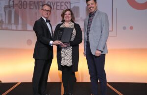 From left to right: Arkansas Business Publisher Mitch Bettis presents the Business of the Year Award in Category I to Portable Kitchens Inc. of Little Rock, represented by Martha James, vice president of finance and administration, and Heath Sorrells, general manager.