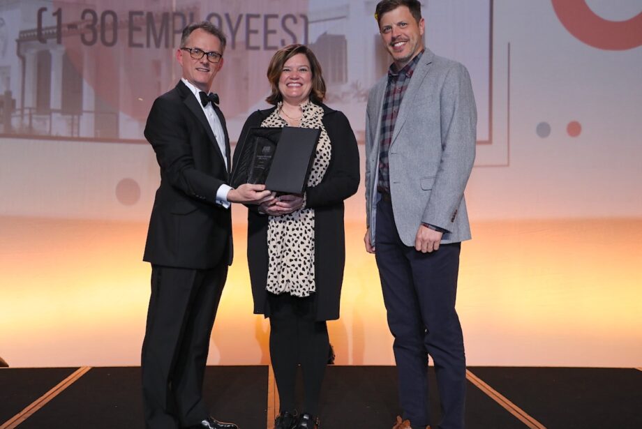 From left to right: Arkansas Business Publisher Mitch Bettis presents the Business of the Year Award in Category I to Portable Kitchens Inc. of Little Rock, represented by Martha James, vice president of finance and administration, and Heath Sorrells, general manager.