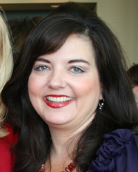 Former One Bank & Trust VP Kelly Harbert was sentenced to 30 months in federal prison and ordered to pay more than $440,000 in restitution.