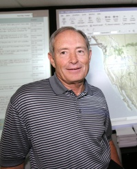 James Hobson, president and CEO of Air Transport International, monitors the company's ops center in Little Rock.