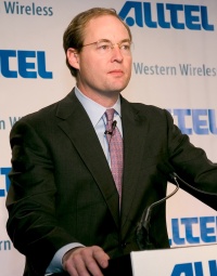 Alltel CEO Scott Ford speaks last year during a news conference announcing Alltel's purchase of Western Wireless. Merger costs weighed on Alltel earnings in the first quarter.