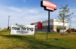 A sign advertising open positions at a Taco John's restaurant in Cheyenne, Wyoming