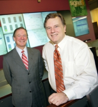 Bill Carlton, left, has started his second career as a growth mentor to Roger Snyder's Signet6 of Little Rock.